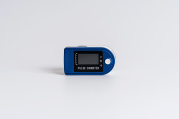 Pulse oximeter on a white background. A device for diagnosing health, pulse and the amount of...
