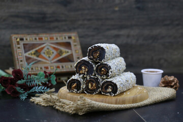 Bowl with pieces of turkish delight lokum on a dark background. Close up