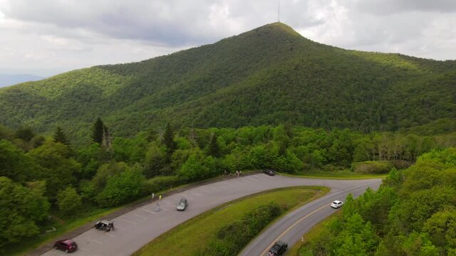 2020 - An excellent aerial shot of cars driving along the Blue Ridge Parkway in North Carolina.