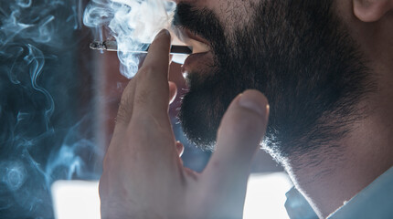 young man smoking cigarette