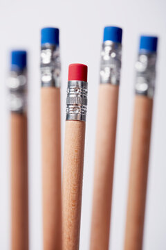 Wooden pencils, one with red eraser