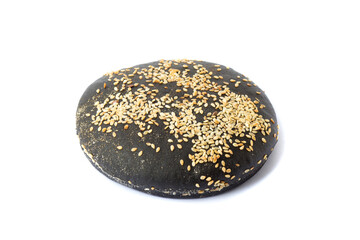 Homemade bun for black burgers with sesame isolated on white background