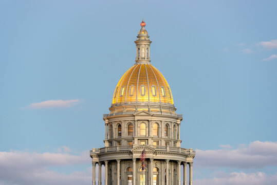 USA, Colorado, Denver, Full moon rising next to State Capitol dome