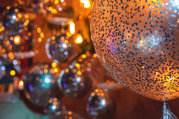 Decoration interior elements of restaurant venue banquet hall with multicoloured different helium balloons, on a indoor corporate event or wedding reception or birthday party celebration