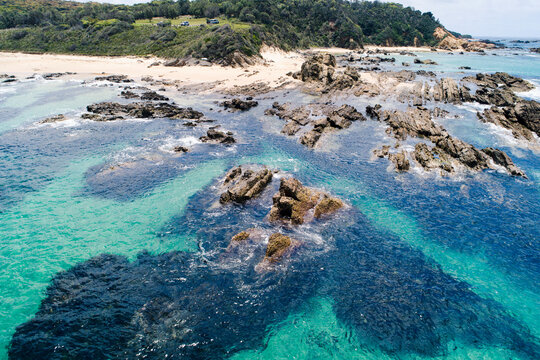 Australia, New South Wales, Bermagui, Sharp rocks in water nera beach