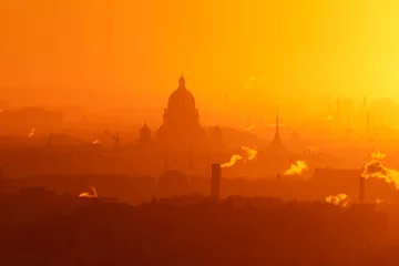 Fotobehang Aerial panoramic view of Saint-Petersburg, Russia, with St. Isaac's cathedral, the Winter Palace and Admiralty, with beautiful vibrant red orange sunset sundown, dusk cityscape silhouette scenery © tsuguliev