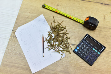 Construction Measuring Tape, Calculator and Self-tapping screws for working with wood products and...
