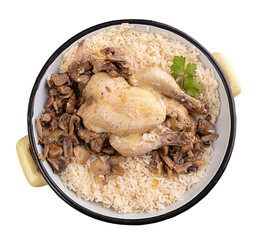 Cockerel with mushrooms and rice in an old enamel dish