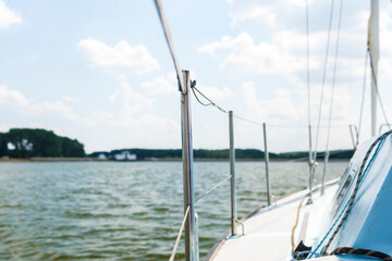 Fototapeta premium Bow of the Small Yacht Under Sailing On Open Waters.