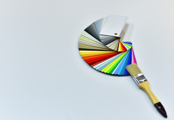 Color palette swatches with paint brush. Palette of different colors and shades on white...