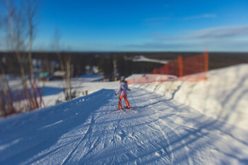 Beautiful cold mountain view of ski resort, sunny winter day with slope, piste and ski lift, with...