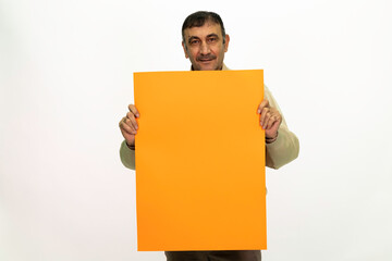 Mature man holding billboard in his hand. isolated image and white background.