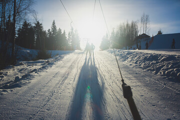 Beautiful cold mountain view of ski resort, sunny winter day with slope, piste and ski lift, with...