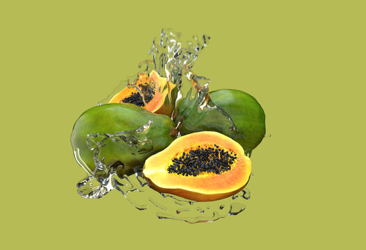Papaya on the green background. Tropical fruit. Splash of water.