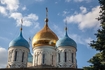 Fototapeta premium Domes of the temple close-up against the sky.