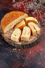 front view sweet pastry sliced in pieces on a dark background pie cake dough