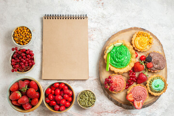 top view delicious cream cakes with fruits on white desk sweet dessert cake biscuit