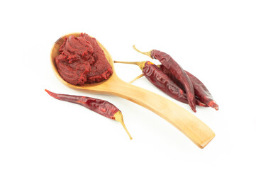 Traditional turkish chili pepper paste in spoon with dried peppers isolated on white background