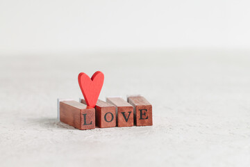The word Love made up of wooden rectangles with letters. Valentine's Day.