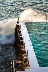 Waves crushing at Bondi Icebergs Pool, Sydney, Australia, in the early morning