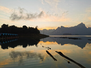 light yellow and grey sunrise over a mountain in thailand