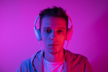 Man Listens to Music With headphones on a Colored Background. Music Poster