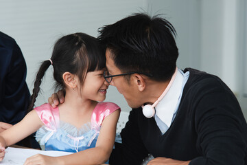Relationship lifestyle asian family. Daddy teaching daughter and daddy playing happiness holidays
