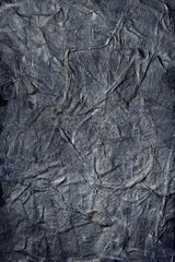 Textured handmade dark textile background with mesh and paper base. Vertical background handmade for design, in black-and-white color