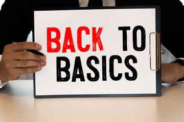 Business concept. Notebook with text BACK TO BASIC sheet of white paper for notes