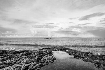 Black and white picture of rocky beach background.