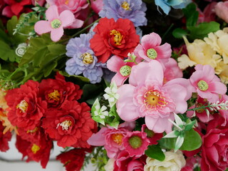 colorful of multicolored artificial flowers background.
