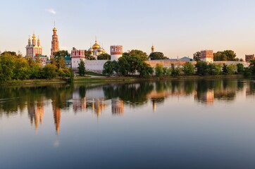 Fototapeta na wymiar view of the novodevichy monastery in moscow on a summer evening from the opposite bank