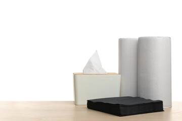 Different clean paper tissues on wooden table