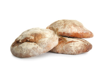 Loaves of delicious fresh bread on white background