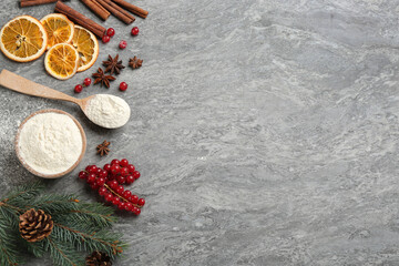 Fototapeta na wymiar Flat lay composition with Christmas decor and flour on grey table. Space for text