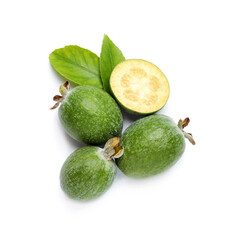 Cut and whole feijoas with leaves on white background, top view