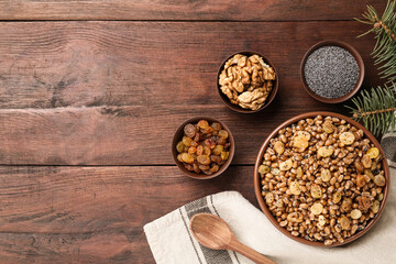 Fototapeta premium Traditional Christmas slavic dish kutia served on wooden table, flat lay. Space for text