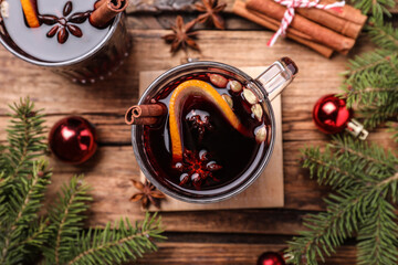 Flat lay composition with aromatic mulled wine on wooden table