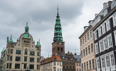 Fototapeta na wymiar Bell tower of The Nikolaj Contemporary Art Center, the former St. Nicholas Church in Copenhagen, Denmark.