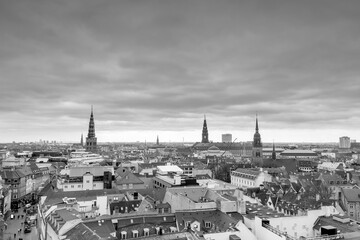 Black and white Aerial view of old downtown of Copenhagen City from the Round Tower (Rundetaarn) and Nikolaj Copenhagen Contemporary Art Center  and Christiansborg Palace and Church of the Holy Spirit