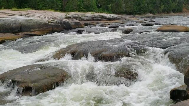 White water rushing at Pabineau Falls, New Brunswick, Canada