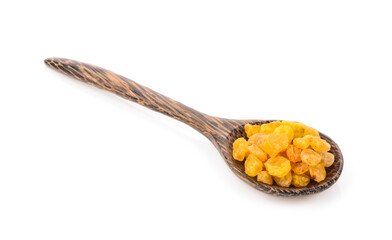 raisin in wood spoon on white background