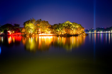 Fototapeta na wymiar The beauty of Ngoc Son Temple and The Huc Bridge at night at Hoan Kiem Lake, Ha Noi, Viet Nam.