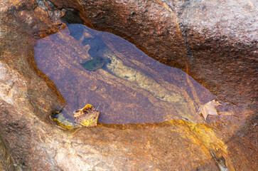 Rocky bed of a mountain river on the background of a mountain landscape.