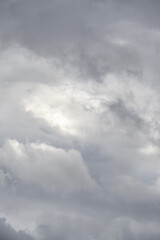 Dramatic stormy sky in shades of gray and white, as a nature background
