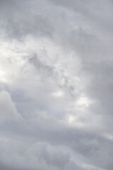 Dramatic stormy sky in shades of gray and white, as a nature background
