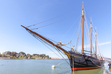 San Francisco, CA, USA - April  2, 2018:  Historical ship C.A. Thayer at Hyde St. Pier in San Francisco, California. The Hyde Street Pier is a historic ferry pier amidst the tourist zone of Fisherman