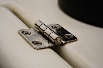 Hinge for connecting moving parts together and enabling opening and closing.