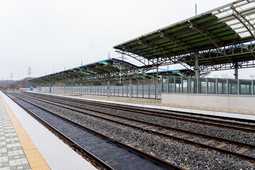 Fototapeta premium Paju, South Korean - April 10, 2019: Platform and railway tracks at Dorasan Station on the Gyeongui Line in Paju, South Korean, which used to connect North Korea and South Korea.