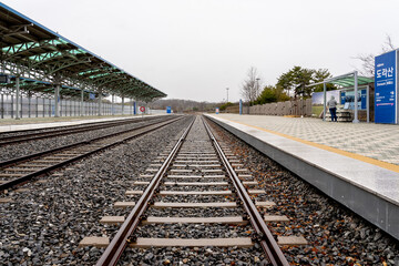Fototapeta na wymiar Paju, South Korean - April 10, 2019: Platform and railway tracks at Dorasan Station on the Gyeongui Line in Paju, South Korean, which used to connect North Korea and South Korea.